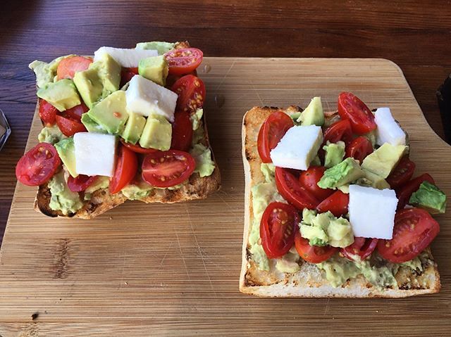 Image of avocado toast with feta and cherry tomatoes, a healthy breakfast option on the Mediterranean diet.