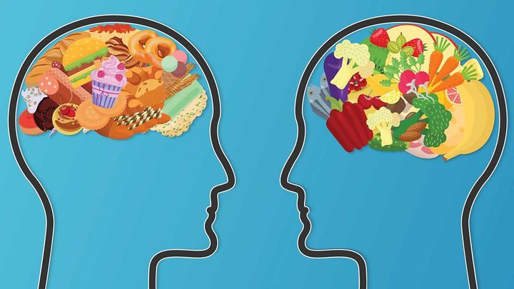 Two heads: one enjoying colorful, nutritious food; the other indulging in junk food. Healthy vs. unhealthy choices.